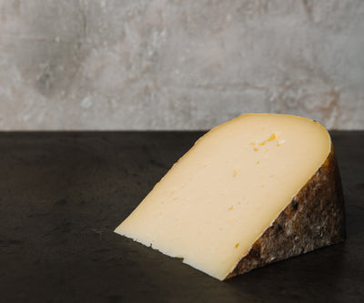 A cut piece of Gouda